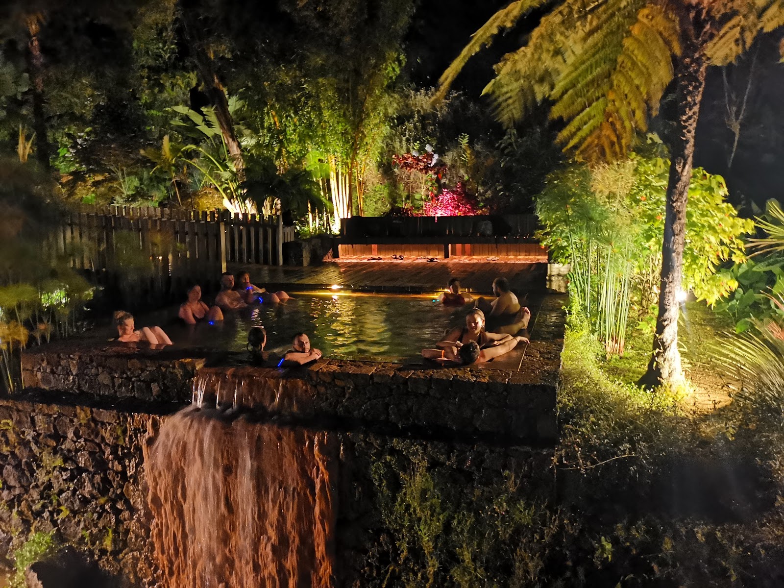 Warm thermal pools lit at night at Poca da Dona Beija in Furnas