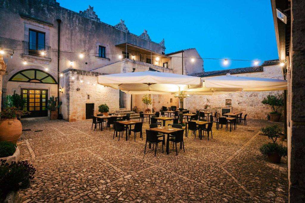 The courtyard terrace at Torre Don Virgilio at dusk